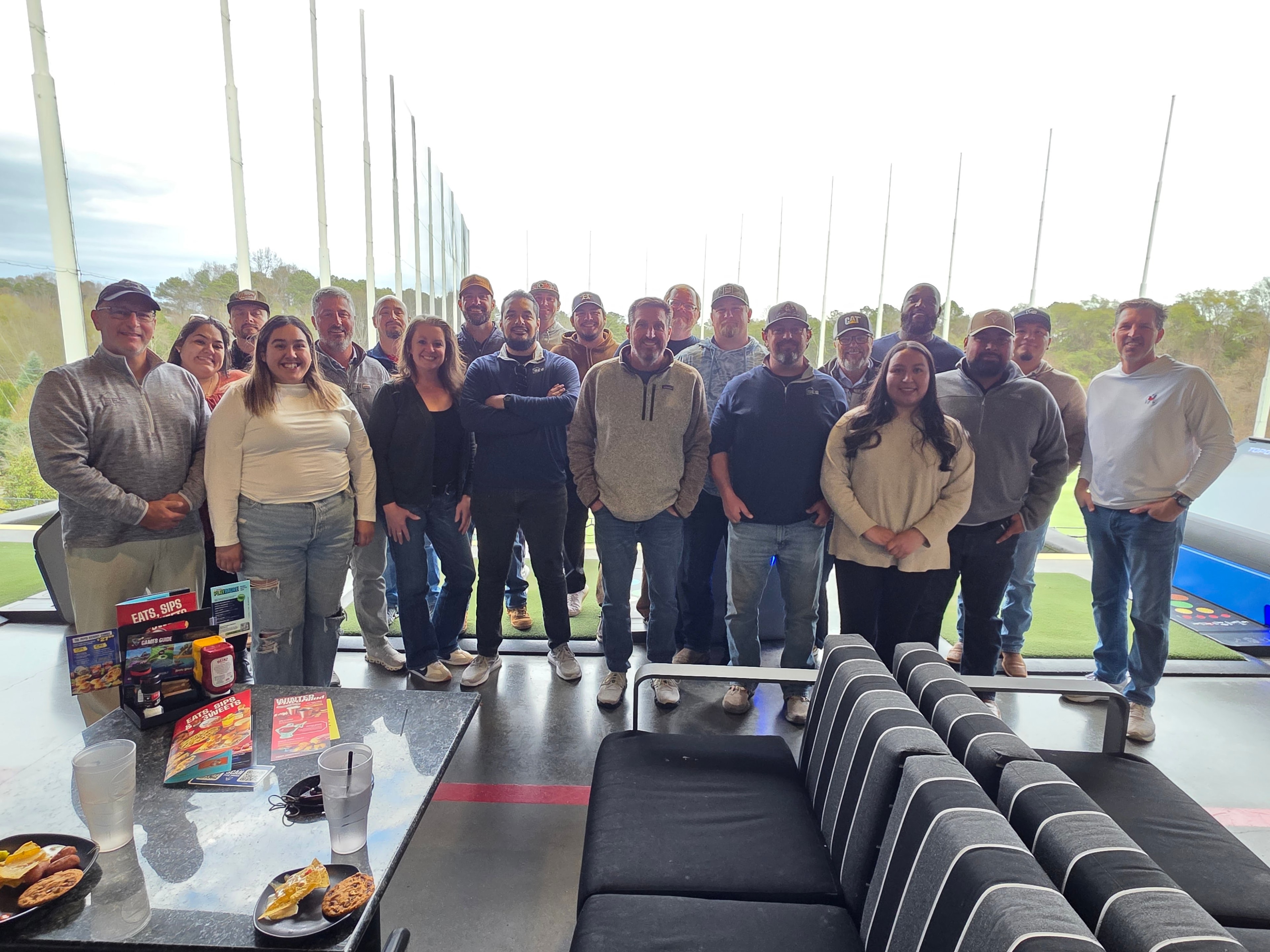 The SES team gathered at Topgolf